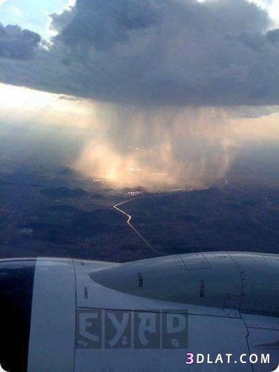صورة من طائرة لمدينة تتساقط بها الامطار