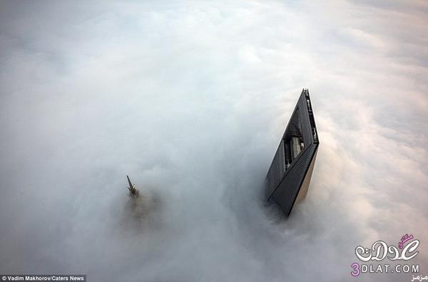 مغامران تسلقا برج شنغهاي أعلى مبنى بالصين
