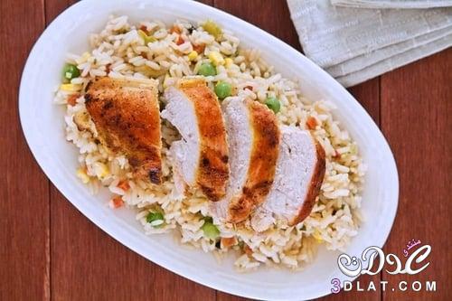 طريقة عمل أرز بالمكسرات وقطع الدجاج