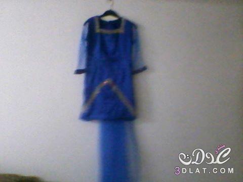 بعدستي فستان من تصميمي باللون الازرق