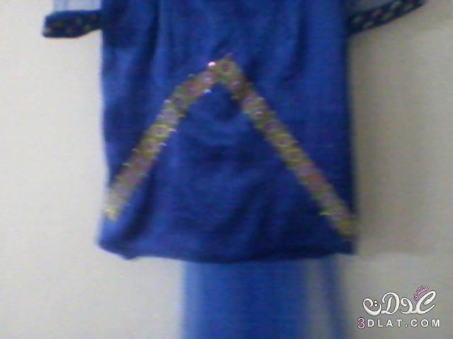 بعدستي فستان من تصميمي باللون الازرق
